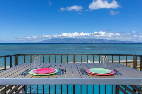 Dine oceanfront on your private balcony with sweeping island views. Feel the ocean breeze as you enjoy meals overlooking the sparkling blue water and distant mountain vistas.