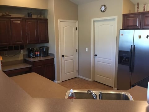 Coffee bar in kitchen with Kuerig.