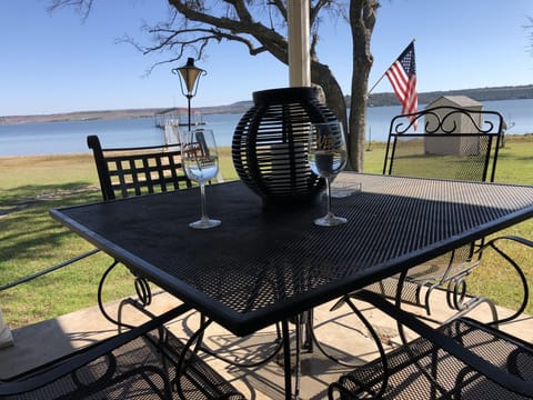 Enjoy a glass of wine on the porch while the kids play in the yard.