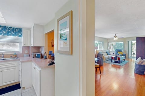 From the entryway.  Kitchen has a pass thru opening to the dining area.