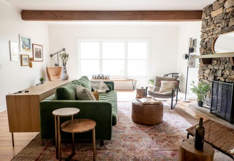 The main living room is perfect for resting or catching up w/ friends or family.