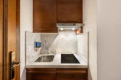 Enjoy the convenience of a compact marble kitchen designed for effortless daily living.