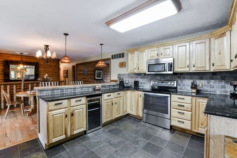 Kitchen with bar and dining table