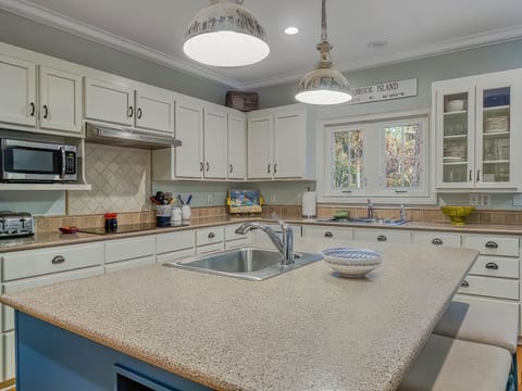 Fully stocked with updated with new new appliances. A sink with a view in this beautiful kitchen.