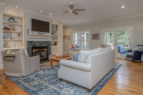 Family room with ample seating. 
French doors to back deck.