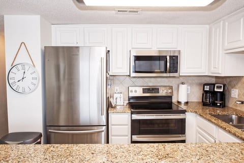 Updated kitchen with SS appliances, double oven and granite countertops.