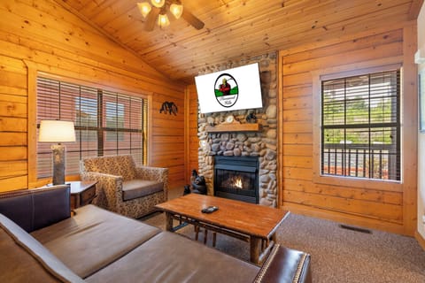 Living Room with Cable TV and Seasonal Fireplace