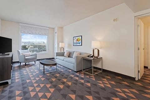 Unit with a flat-screen TV and a sofa