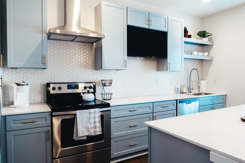 Designer hood and built-in 40" TV for a casual living room experience