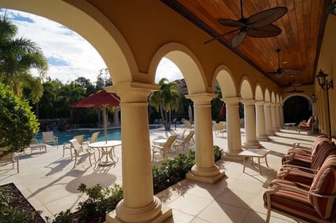 Loggia exit from clubhouse with pool deck visible to left