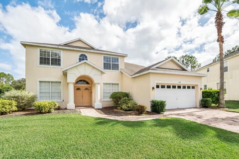 Beautiful two-story home with manicured landscaping and bright curb appeal.