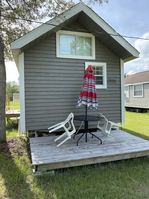 Deck on the end with table and chairs, outside sitting area