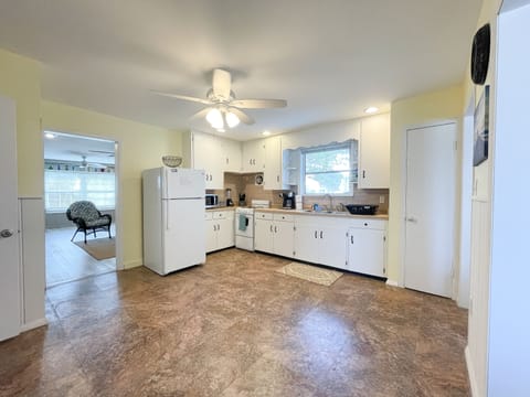 full stocked kitchen. stove, refrig, microwave, coffee maker, toaster, blender