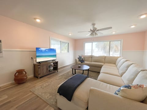 living room with a sectional and television