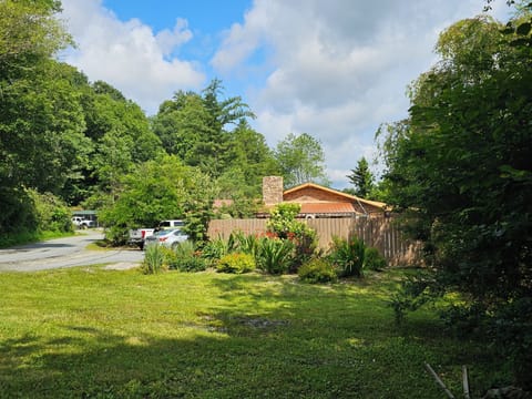 Additional view of side of home and parking area.