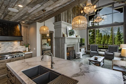 Main Floor Interior - Main floor living room, gas fireplace and kitchen.