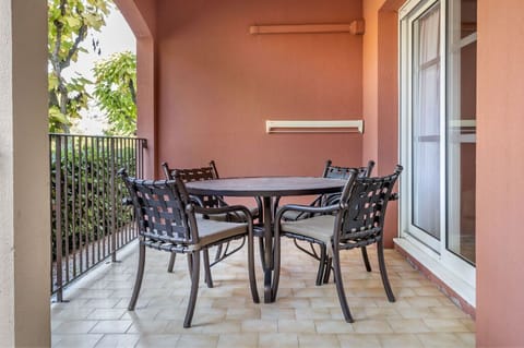 Spacious terrace with outdoor seating, ideal for dining under the sky.