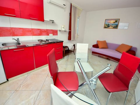 Red, Room, Interior Design, Property, Furniture, Architecture, Building, Table, Floor, Design