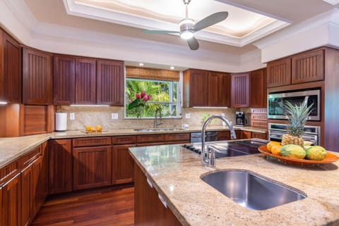 Many cooking gadgets and kitchenware in this gourmet kitchen.
