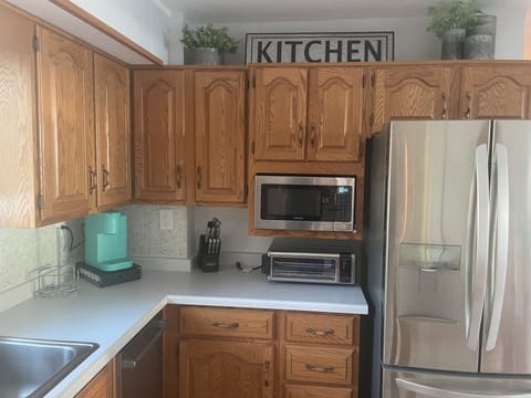 Convection oven,  Keurig coffee, Double burner is found in the cabinet.