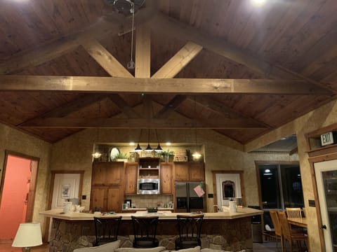 Kitchen has two dining areas and a bar with seating for 18