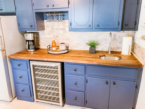 Wine and coffee bar with second refrigerator.