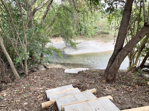 Walk down to a private creek in the backyard. 