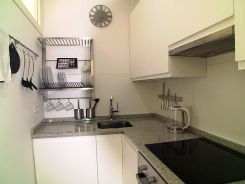 space saving kitchen with built in washing machine, dishwasher, hob, oven etc
