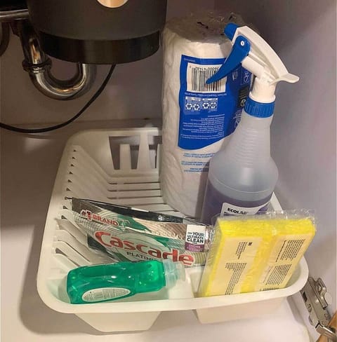 Stocked cleaning items, under the sink.