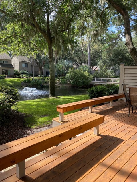 Lagoon view with beautiful water feature and large deck with plenty of seating.