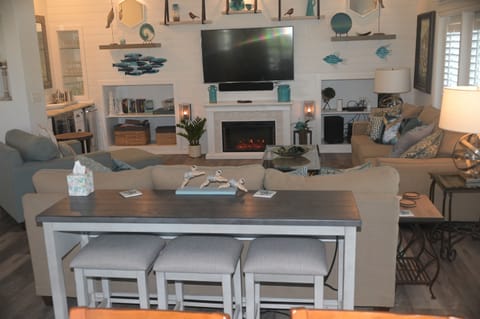 Added sofa table with bar stools and charging 2023