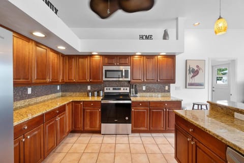 The fully equipped kitchen is stocked and ready for any cooking endeavor.
