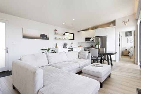 Open-concept kitchen, dining, and living room.