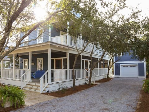 - Welcome to your dream coastal escape, wrapped in charm and southern style porches - Nestled under shady trees with a private driveway, peace and privacy await - Sip your morning coffee on the porch swing or unwind after a beach day