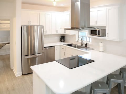 - Cook up in this fully stocked kitchen with stainless steel appliances - Spacious countertops, modern range, & bar seating make it perfect for morning coffee or happy hour - Whether you're a chef or just reheating leftovers, this kitchen’s got you c