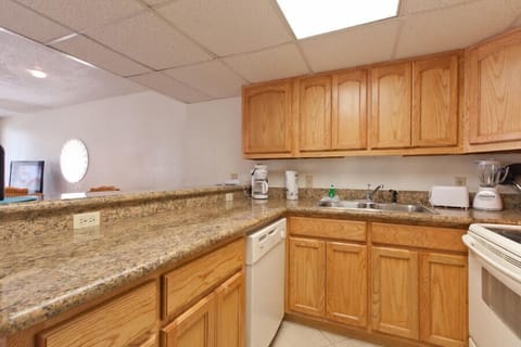 Our kitchen is fully equipped and looks over the dining space.