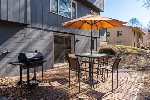 Weber charcoal BBQ grill & small outdoor patio seating area for your enjoyment. 