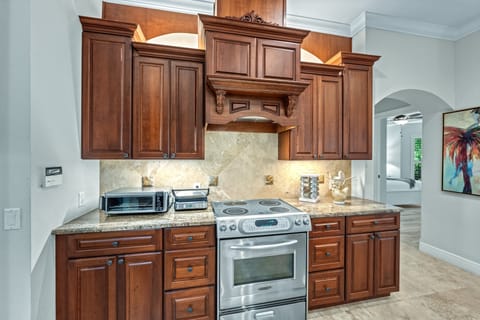 A thoughtfully stocked kitchen featuring a state-of-the-art panini press, perfect for easy lunches or quick bites between outings.