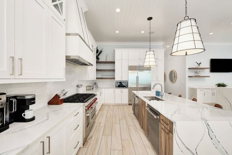 Your gourmet kitchen awaits with marble countertops, professional appliances, and pendant lighting for memorable meals and conversations.