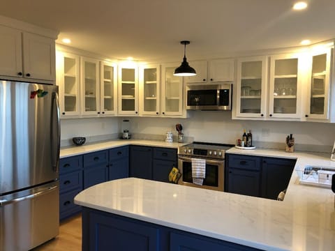 Kitchen outfitted with high end brand new appliances and accessories