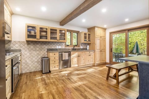 Spacious fully equipped kitchen with stainless steel appliances.