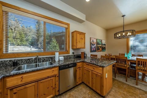 Beautiful fully equipped kitchen with knotty pine accents.