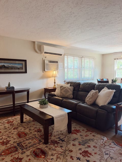 Relax and enjoy this spacious living room with all of the comforts of home.