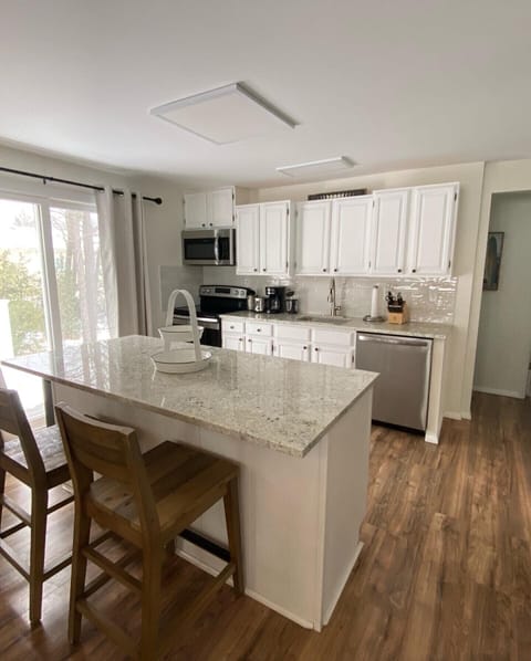 Newly updated kitchen with brand new granite countertops and appliances.