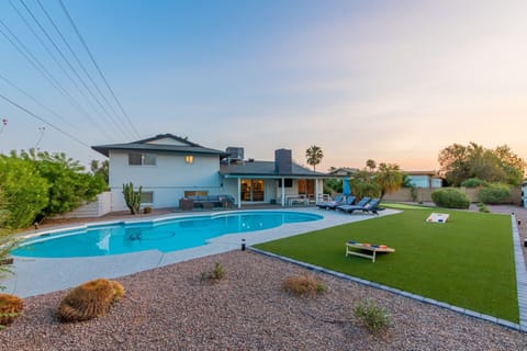 amazing back yard -- pool can be heated upon request (inquire for details) - fire pit, turf area for yard games & putting green