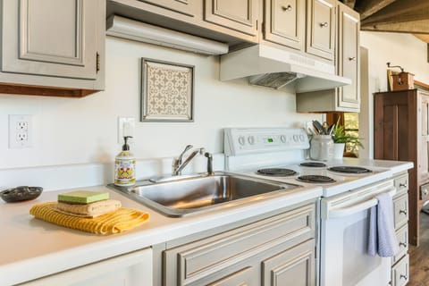 Fresh linens and soaps in a well stocked kitchen
