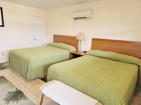 Two cozy queen size beds with cotton sheets