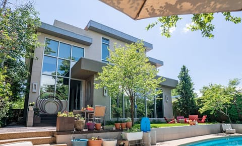 Private backyard oasis with a seasonal pool, endless swim jets, fire pit, BBQ