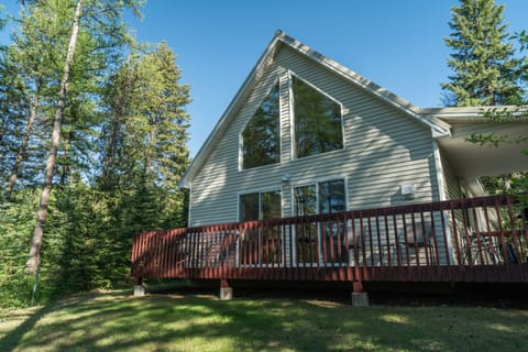 House and deck facing West Glacier Entrance.  Newly stained deck 2020
