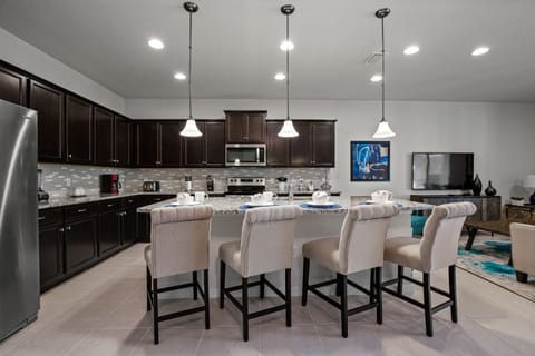 Classy barstool seating facing the kitchen